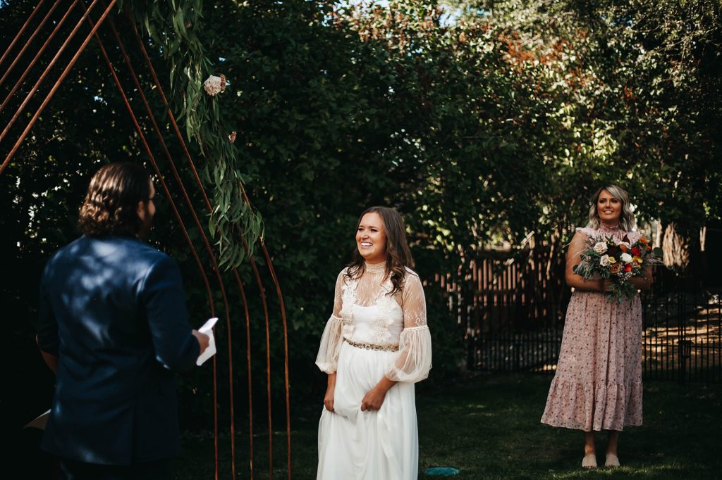 Kelowna Backyard wedding, couple standing in their backyard